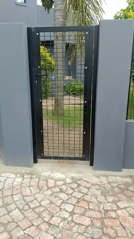 Pedestrian gate between walls — Jozelle Fencing & Projects