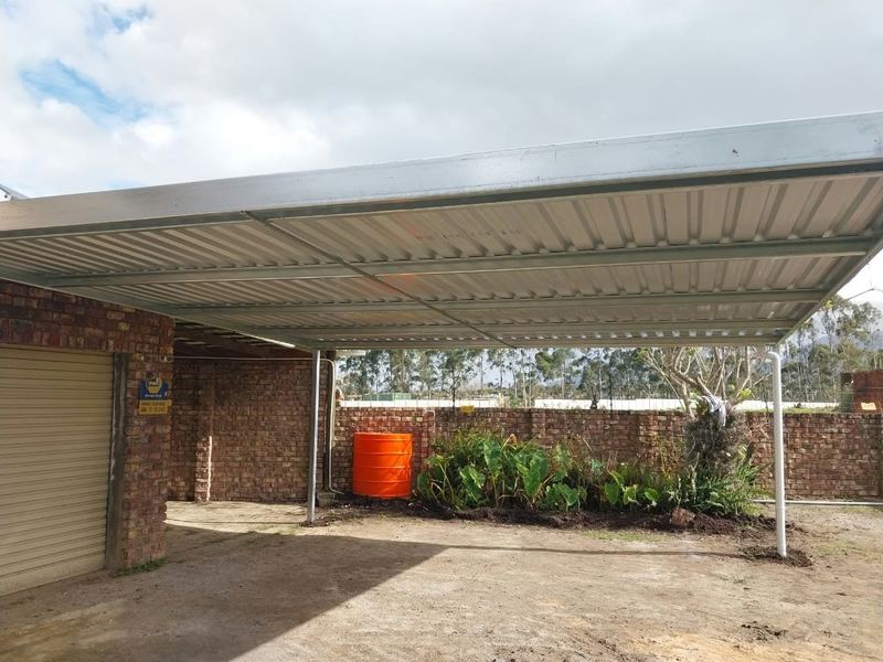 Steel carport built over a driveway